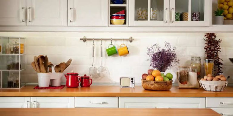 Zero-waste living often gets pictured as glass jars, matching bamboo utensils, and a kitchen that looks like it belongs in a magazine. That version is expensive, and honestly, it's not really the point. The core idea behind zero-waste is using less and wasting less, which usually means spending less too, not more. You don't need to buy a single new product to start. Most of the biggest wins come from small habit changes and reusing things you already have. Start With What's Already in Your Kitchen Before buying anything "eco-friendly," take stock of what you already own. Old jars, takeout containers, and worn-out towels can all be repurposed instead of replaced. A glass jar from pasta sauce works just as well for storing leftovers as anything sold specifically for that purpose — the only difference is the price tag. Rethink Food Storage Before Buying Anything New Plastic wrap and sandwich bags are usually the biggest source of kitchen waste, and they're also one of the easiest to cut down. Beeswax wraps and reusable containers get recommended a lot, but you don't need to buy a full set right away. Start by simply using containers you already own more consistently, and replace disposable wrap only as it naturally runs out, rather than throwing away what's left to "start fresh." Shop With Waste in Mind, Not Just Price Buying in bulk, when it's realistic for your storage space, usually cuts down on packaging significantly compared to individually wrapped portions. It's also worth choosing loose produce over pre-packaged when the price difference is small or nonexistent — a lot of grocery stores now offer both, and shoppers often default to the packaged version out of habit rather than preference. Start Composting, Even Without a Yard Composting sounds like something that requires outdoor space, but small-scale indoor composting is genuinely possible in an apartment. A simple countertop bin for food scraps, combined with a local drop-off point (many cities now offer these at farmers markets or community gardens), keeps food waste out of the trash without needing a backyard at all. Use Food Scraps Before Tossing Them Vegetable peels, herb stems, and bones can go into a bag in the freezer and get turned into stock later instead of being thrown away immediately. Overripe fruit that's a little too soft to eat raw still works fine in smoothies or baked goods. A surprising amount of what gets labeled "waste" is actually still usable — it just needs a different plan. Buy Secondhand Before Buying New If you do want actual zero-waste products — cloth napkins, glass containers, reusable produce bags — thrift stores and secondhand marketplaces often have them for a fraction of retail price. Buying new isn't necessary to build a more sustainable kitchen, and secondhand items usually work exactly the same as new ones. Keep a Running List of What Actually Gets Wasted For one week, keep track of anything that ends up in the trash from your kitchen — not judgmentally, just observationally. This usually reveals a pattern: maybe it's produce that spoils before it gets used, or takeout containers that pile up. Once you know the actual pattern, it's much easier to fix than trying to overhaul everything at once. This pairs well with the approach in our guide on saving money on a tight budget — reducing waste and reducing spending usually go hand in hand. The Bottom Line A zero-waste kitchen isn't about buying the right products — it's about using what you have more intentionally. Most of the impact comes from small, repeated habits rather than a single big purchase. Start with one change, let it become routine, and build from there.